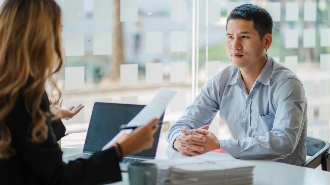 business-cooperation-concept-of-two-young-asian-business-partner-organizations-man-and-woman-sitting-at-desk-with-laptop-working-paperwork-together-colleagues-discuss-company-finances-stockpack-istock.jpg