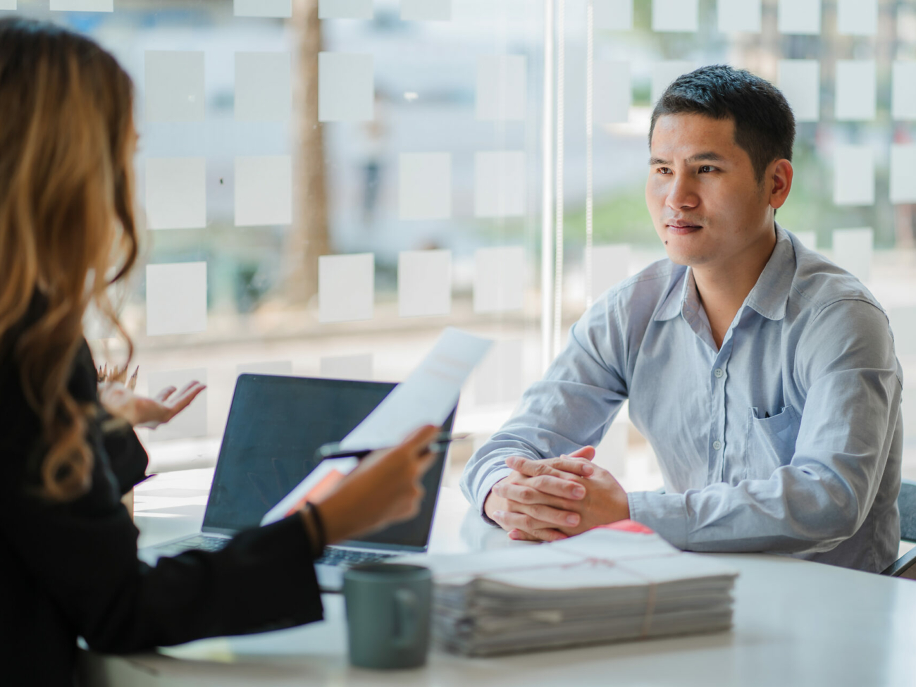 business-cooperation-concept-of-two-young-asian-business-partner-organizations-man-and-woman-sitting-at-desk-with-laptop-working-paperwork-together-colleagues-discuss-company-finances-stockpack-istock.jpg