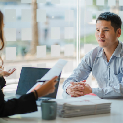 business-cooperation-concept-of-two-young-asian-business-partner-organizations-man-and-woman-sitting-at-desk-with-laptop-working-paperwork-together-colleagues-discuss-company-finances-stockpack-istock.jpg