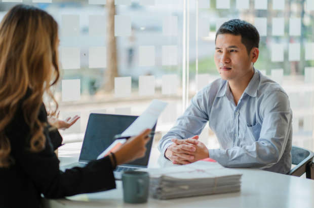 business-cooperation-concept-of-two-young-asian-business-partner-organizations-man-and-woman-sitting-at-desk-with-laptop-working-paperwork-together-colleagues-discuss-company-finances-stockpack-istock.jpg