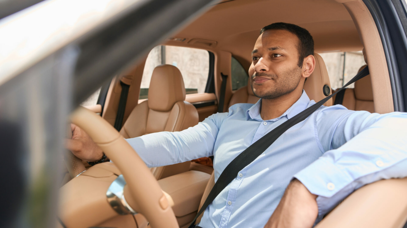 calm-driver-sitting-in-front-seat-of-automobile-fastened-with-seat-belt-stockpack-istock.jpg