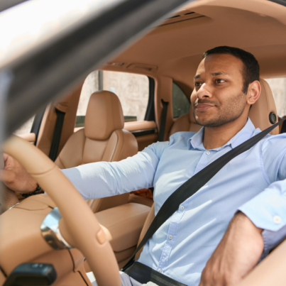 calm-driver-sitting-in-front-seat-of-automobile-fastened-with-seat-belt-stockpack-istock.jpg