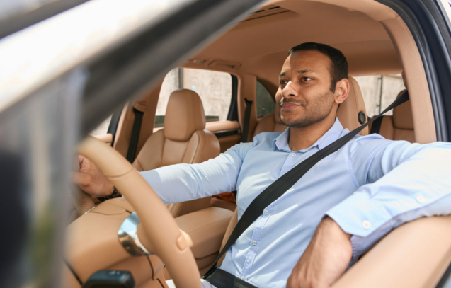 calm-driver-sitting-in-front-seat-of-automobile-fastened-with-seat-belt-stockpack-istock.jpg