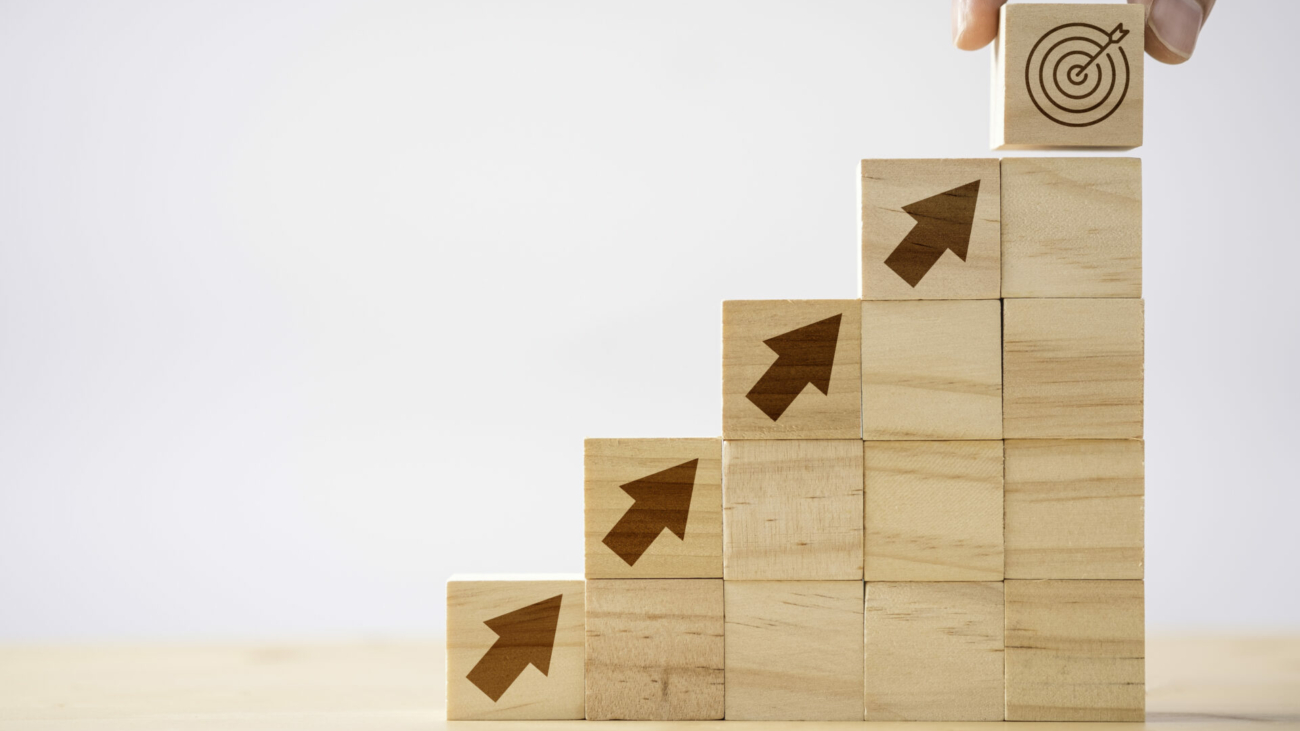 hand-putting-print-screen-dart-and-target-board-wooden-cube-on-up-arrows-target-of-investment-and-business-concept-stockpack-istock.jpg