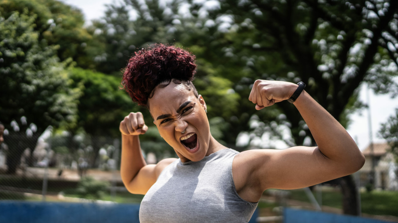 portrait-of-a-young-woman-celebrating-at-a-sports-court-stockpack-istock.jpg