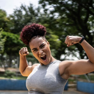 portrait-of-a-young-woman-celebrating-at-a-sports-court-stockpack-istock.jpg