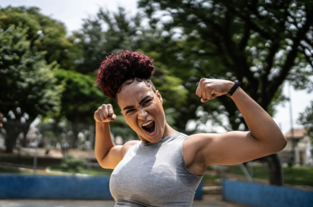 portrait-of-a-young-woman-celebrating-at-a-sports-court-stockpack-istock.jpg