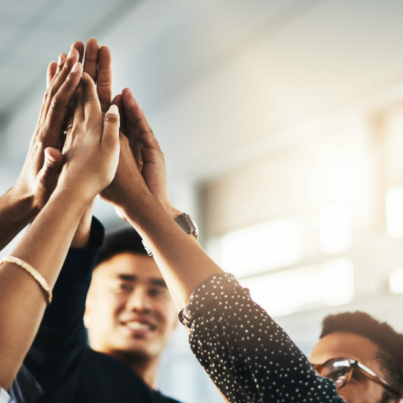 shot-of-a-group-of-unrecognizable-businesspeople-high-fiving-in-an-office-stockpack-istock.jpg