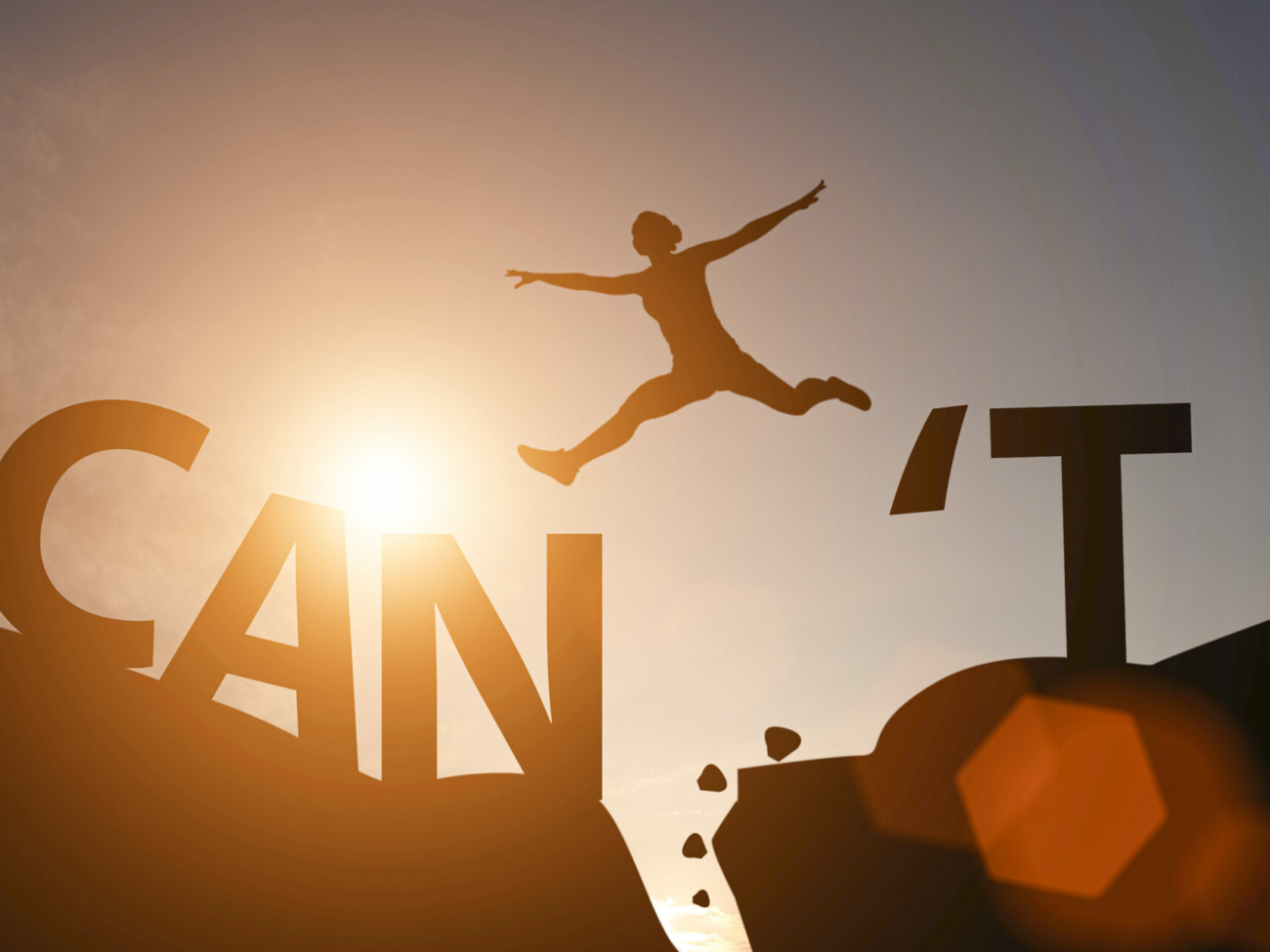 silhouette-man-jump-between-cant-wording-and-can-wording-on-mountain-mindset-for-career-growth-business-stockpack-istock.jpg