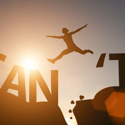 silhouette-man-jump-between-cant-wording-and-can-wording-on-mountain-mindset-for-career-growth-business-stockpack-istock.jpg