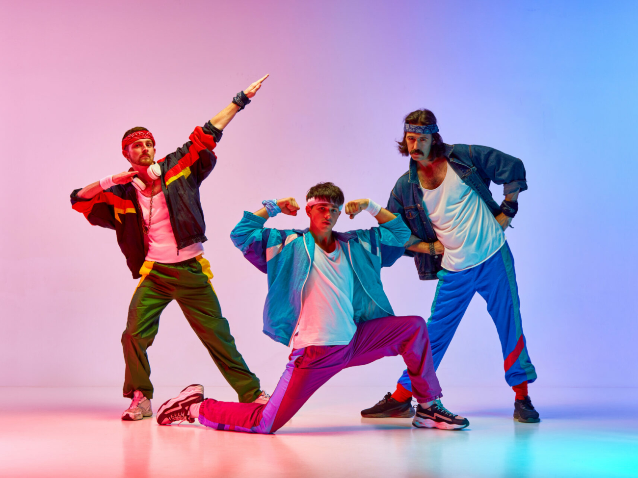 stylish-handsome-three-men-on-old-style-sportswear-training-against-gradient-pink-blue-background-in-neon-light-concept-of-sportive-and-active-lifestyle-humor-retro-style-ad-stockpack-istock.jpg