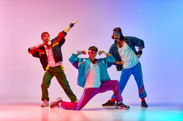 stylish-handsome-three-men-on-old-style-sportswear-training-against-gradient-pink-blue-background-in-neon-light-concept-of-sportive-and-active-lifestyle-humor-retro-style-ad-stockpack-istock.jpg