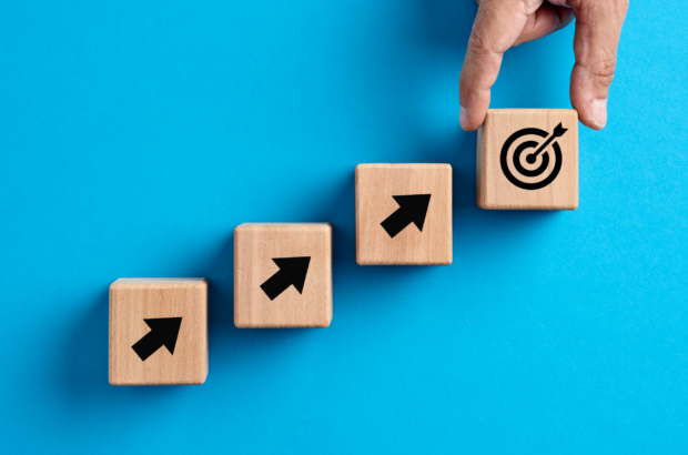 target-goal-achievement-goal-setting-business-objectives-growth-and-success-concepts-hand-places-a-wooden-cube-with-target-goal-icon-stockpack-istock.jpg