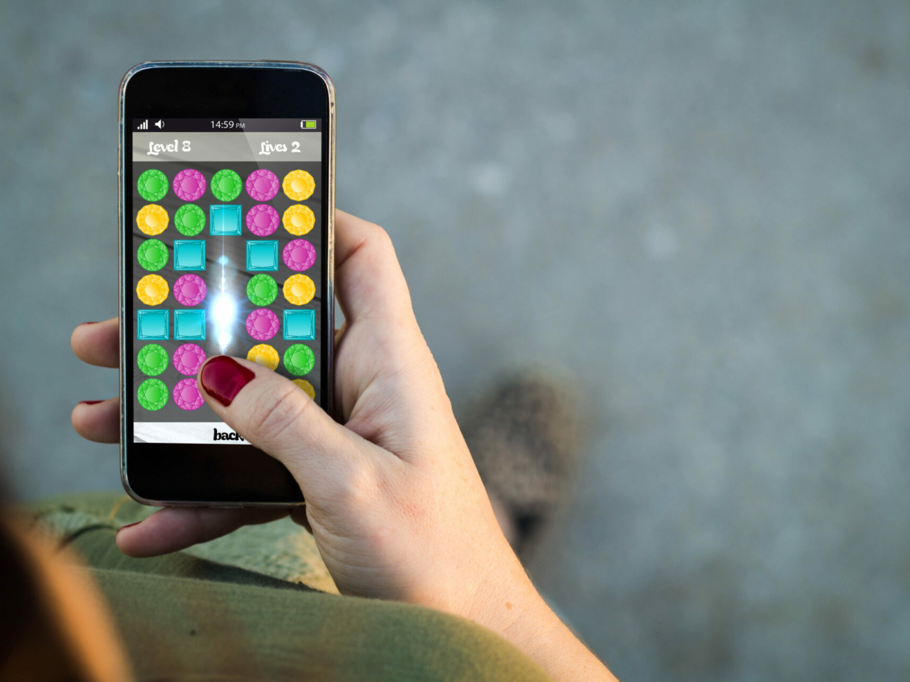 top-view-of-woman-walking-in-the-street-using-her-mobile-phone-with-mobile-game-in-the-screen-with-copyspace-all-screen-graphics-are-made-up-stockpack-istock.jpg